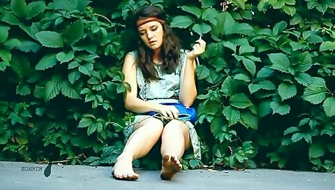 Adorable Brunette Hippy Gal Sits In Shrubs And Her Dirty Feet While Smoking